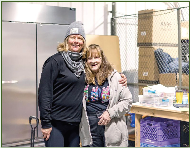 Volunteers Deb and Pam smiling at First Church in McHenry